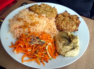 Vegetable Fritters + Rice w/tomato + Hummus + Carrot salad (vegan) at La Bonne Heure in Paris