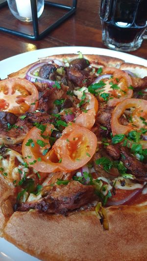 Vegan oumph pizza with chili aioli at Peppes Pizza in Narvik