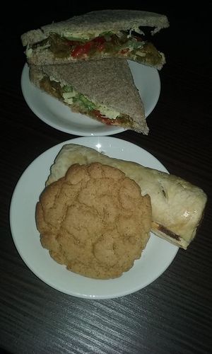 Sandwich, sausage roll and cookie. Yum yum. at Vegano  in Galway