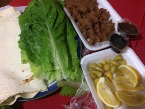 kofte (vegan meatballs from bulgur), enjoyed with lavash flatbread, pomegranate sauce, spicy pepper sauce, lemon and peppers. at CMR Cig Kofte in Kyrenia