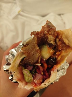 Vegan döner wrap with fresh salad, onions, roasted veggies, and vegan garlic and chilli sauces. The meat was some of the best vegan meat I've ever had at Helin's Döner in Amsterdam