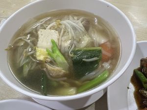 Noodle soup with kway Tito (flat noodles)  at Happy Vegan - สุขใจมังสวิรัติ in Bangkok