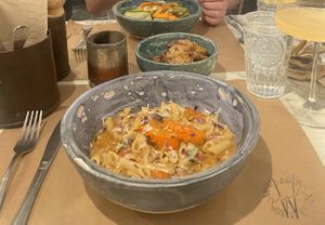 Pumpkin pasta and curry noodles (special) in the background.  at Winners Vegan Restaurant in Athens