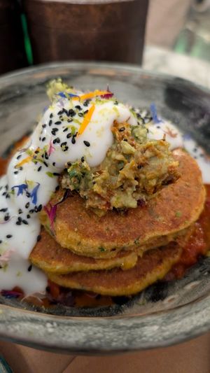 Corn pancakes with guacamole and salsa -- our favorite dish. We shared this as an appetizer at dinner. at Winners Vegan Restaurant in Athens