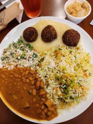 Rice, beans, peanut farofa, vegan meatballs with mashed potatoes at Pratada  in Sao Paulo