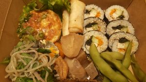 Dinner dish - Maki, nems, edamame, tofu steak and veggies at Itadakizen Paris in Paris