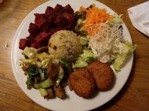The main course (beet and tofu combo, vegetable seitan stir fry, falafel, coleslaw, olive corn couscous) at Water en Brood in The Hague