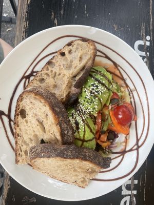 Bowl with avocado and raspberry dressing   at EM Breakfast Club in Hamburg