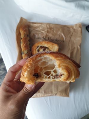 Pain au chocolat, olive baguette, escargot at Land & Monkeys - Beaumarchais in Paris