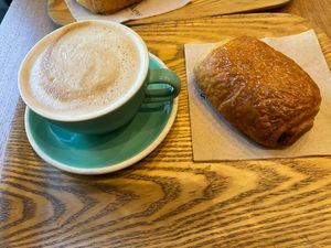 Pain au chocolate with latte  at Land & Monkeys - Beaumarchais in Paris