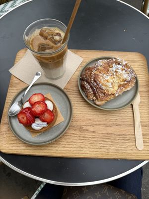 Iced latte with soy, strawberry tarts, and almond chocolate croissant  at Land & Monkeys - Beaumarchais in Paris