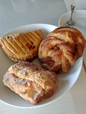 Almond pain au chocolat, cinnamon roll, chausson aux pommes at Land & Monkeys - Beaumarchais in Paris
