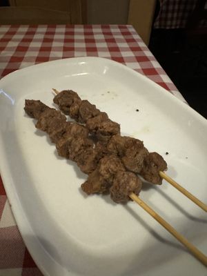Complimentary lamb skewers   at Al Sanpietrino Trattoria in Lisbon
