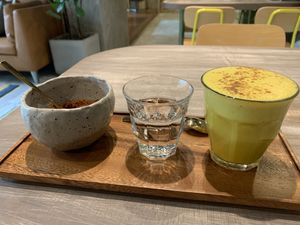 Turmeric soy latte with THE perfect foam on top. at Genius Central in Central Singapore