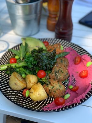 Vegan plate with falafels, beetroot hummus, potatoes, kale. at The Bean Brewers in Chippendale