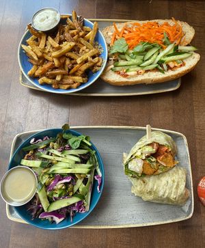 Top: The banh mi with a side of garlic fries. 
Bottom: The chikin caesar wrap with a side of green salad at Vegan Street in Calgary