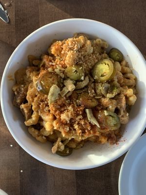Mac and cheese w/ jalapeños & beyond bratwurst at Vegan Street in Calgary