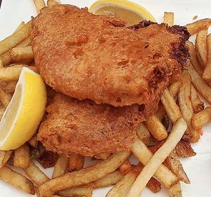 Beer battered house-made no-fish and chips with fresh cut fries, house tartar, and slaw.  at Vegan Street in Calgary
