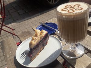 Hazelnut cake and chai latte with oat milk at KIRAS in Kaunas