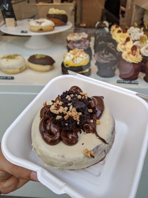 vegan cronut with vegan muffins behind at Chök in Madrid