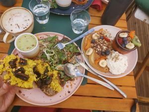 On right the sweet pancakes with fruit and small yogurt bowl with fruit at Urban Greener in Paris