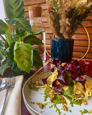 Tagliatelles à la crème d'amande, pesto d'oseille et noix, pousses de betteraves. at Urban Greener in Paris