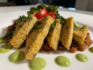 Cashew Cheese Crispy Polenta with Arugula Puree, Lentil Ragu and Caramelized Broccoli at Chef 2 The Rescue in Haslet