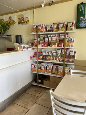 Snacks and Takeaway Goodies Near Counter  at Loving Hut in Orange