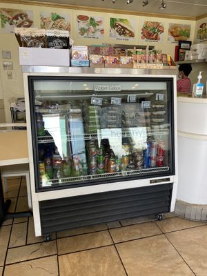 Drink and Vegan Cake Display Case  at Loving Hut in Orange
