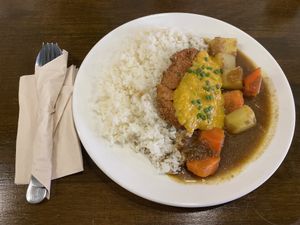Katsu curry with vegan “fish” and dayia cheese! at Veganerie - Nana in Bangkok