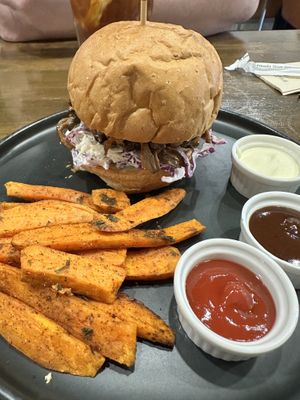 Pulled “pork” burger and sweet potato fries   at Veganerie - Nana in Bangkok