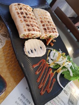 There's the red sauce!!!!! Mmmm. (Falafel wrap) at Asalam Restaurant in Jeju