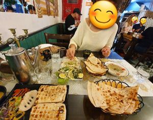 A delicious feast! 2 orders of hummus, salad, bread, and a falafel sandwhich. at Asalam Restaurant in Jeju
