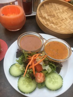 two types of sauce: peanut and spicy vegetables and salad at Buddha Haus in Berlin