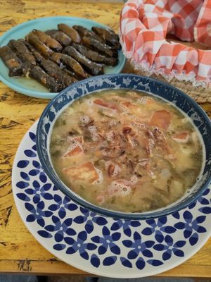 Lentil soup-kinda thing and grape leaves. In the basket there's bread, which was just an extra. at Dar Ne'meh in Amman
