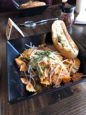 Pasta bar.. bow tie pomodoro with sweet Italian sausage, asparagus, and basil 🌿  at Tarantino's Vegan in Las Vegas