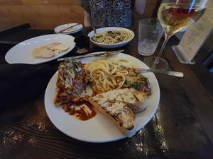 Entrée sampler, oyster mushroom pasta in the background at Tarantino's Vegan in Las Vegas