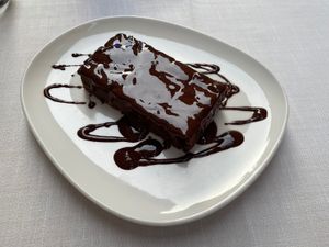 Traditional cake topped with melted chocolate  at Il Lughino in Como