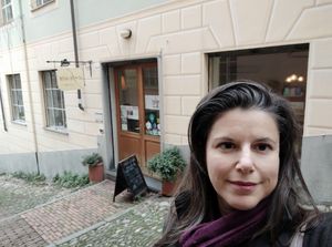 Your vegan guide in front of a vgan restaurant at Genoa Vegan Tours in Genoa