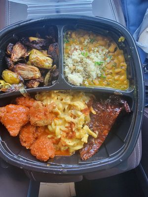 Curried black-eyed peas, brussel sprouts, jackfruit ribs, mac n triple cheese, coconut maple siracha cauliwings at I-tal Garden in New Orleans