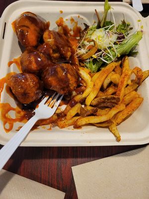 Cauliflower wing meal (BBQ Sriracha sauce), side salad, seasoned fries at I-tal Garden in New Orleans