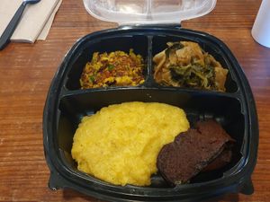 Yellow grits, bacon, creole greens and chickpea scramble at I-tal Garden in New Orleans