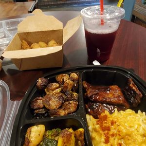 Vegan ribs, Mac, Brussel sprouts, mixed veggies & avocado fries. at I-tal Garden in New Orleans