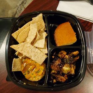 Crab cake, Brussel sprouts, chips with cashew cheese sauce & corn bread. at I-tal Garden in New Orleans