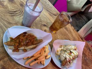 Vegan hot dog with chile con carne topping and avocado + fries and a black sesame mylkshake. Vegan hot dog with tomatoes, corn, vegan mayo.  at Bells in Tokyo