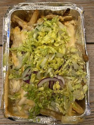 Vegan kapsalon: Fries, shoarma, chilimayonaise, melted cheese and fresh vegetables (lettuce, cucumber and red onion) at De Beren in Goes