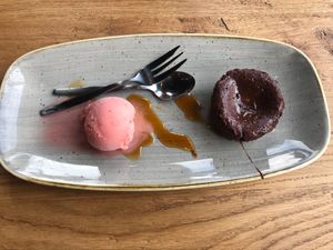 Chocolate moulleux (chocolate tart with a gooey inside) and raspberry sorbet. at De Beren in Goes
