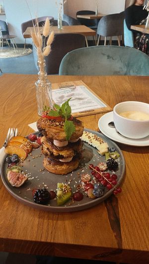 very good chocolate pancakes with fruits and oatmilk cappuccino😻  at SOUL - Vegan Coffee Bar in Hamburg