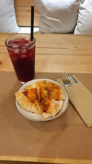 Pita with garlic & oregano, it was like a mini pizza and was only a side! at Boa Beach in Valencia