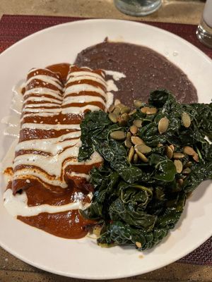 Enchiladas with refried black beans and greens at Gracias Madre in San Francisco